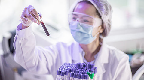 Lab worker with blood samples